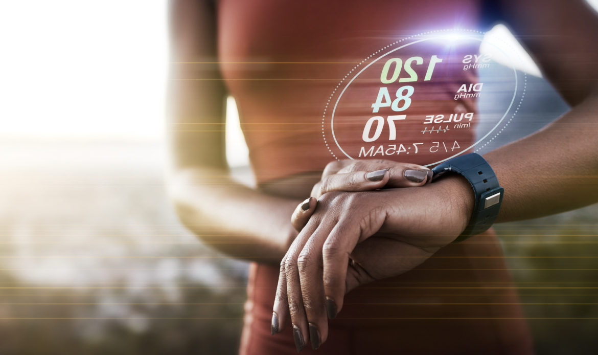 Woman wearing a fitness tracker smartwatch to monitor health data and performance